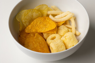 Many Crispy Snacks food potato chip salty. Fast food or junk food snacks unhealthy concept.