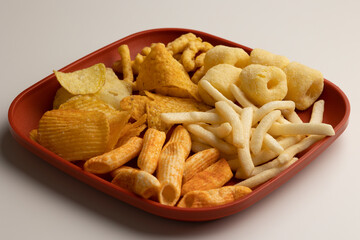 Many Crispy Snacks food potato chip salty. Fast food or junk food snacks unhealthy concept.