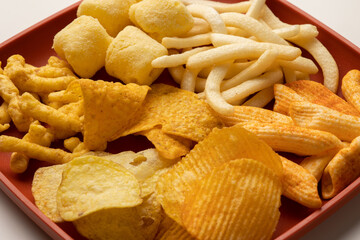 Many Crispy Snacks food potato chip salty. Fast food or junk food snacks unhealthy concept.