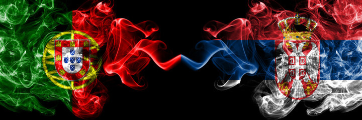 Portugal, Portuguese vs Serbia, Serbian smoky mystic flags placed side by side. Thick colored silky abstract smoke flags.