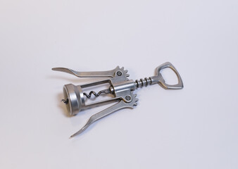 Closeup view of a silver wine opener isolated on a white background