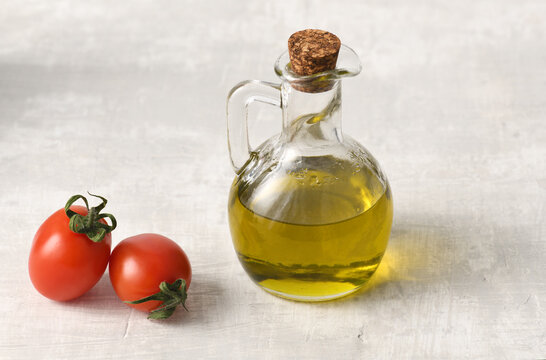 Small bottle with olive oil and tomatoes