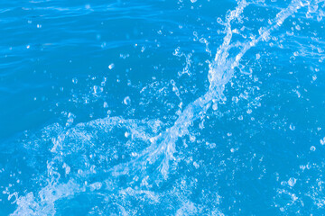 Splashes of fresh clean blue seawater close-up background