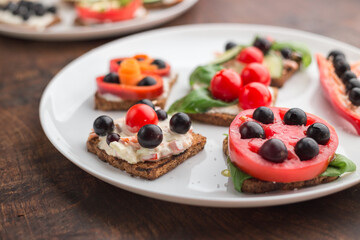 Tasty looking vegetarian sandwiches on a white plate