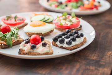 Freesh vegetarian sandwiches on a white plate