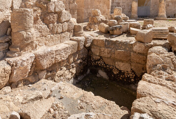 Ritual  Jewish bath for bathing - mikveh - in the courtyard of the ruins of the palace of King Herod - Herodion in the Judean Desert, in Israel