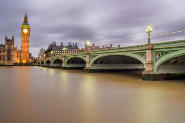 Big Ben and the House of Parliament of UK viewed from the opposite side of River Thames, along with Westminster Bridge
