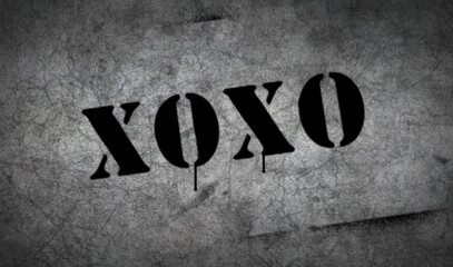 Xoxo symbol spray painted on the concrete wall