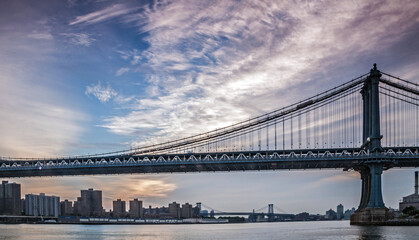 Fototapeta na wymiar The Brooklyn bridge in New York with the Manhattan skyline on the background.