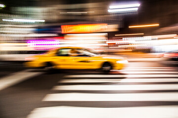 New York  yellow taxi cab speeding on the streets  of New York.