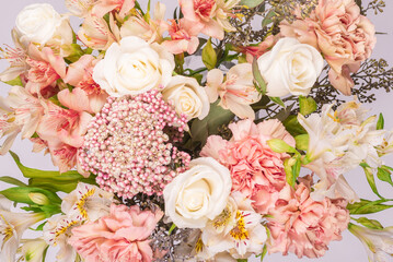 Bouquet of  soft pink flowers in wrapping paper.