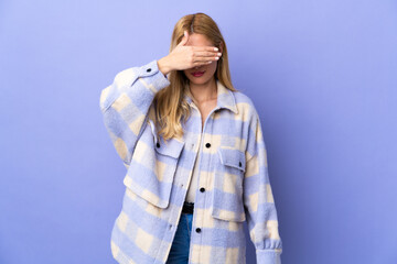 Young Uruguayan blonde woman over isolated background covering eyes by hands. Do not want to see...
