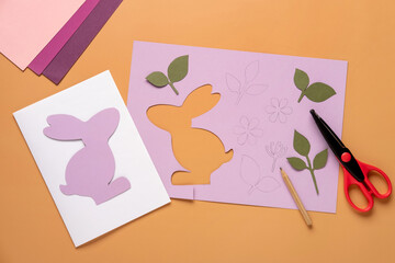 Step 5. Step by step instruction: how to make a Easter card out of colored cardboard. Easter card with bunny.