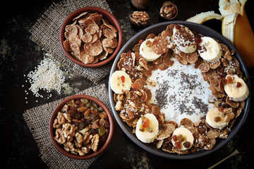 Healthy breakfast bowl. Chia yogurt with banana and muesli. Delicious healthy eating.