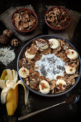 Healthy breakfast bowl. Chia yogurt with banana and muesli. Delicious healthy eating.