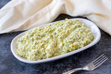 An appetizer prepared with feta cheese and pistachios. Traditional Turkish and Arabic cuisine meze. Snack meal served alongside the main course. Natural vegetarian food. Local name grit ezmesi mezze