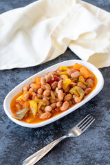 Kidney bean appetizer. Traditional Turkish and Arabic cuisine meze. Snack meal served alongside the main course. Natural vegetarian food. Barbunya plaki. Chili beans