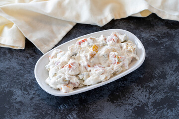 Panco appetizer prepared with potatoes, yogurt and peppers. Traditional Turkish and Arabic cuisine meze. Snack meal served alongside the main course. Natural vegetarian food. Local name Panco mezze