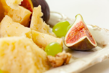 cheese plate, nuts, honey, figs