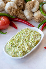 An appetizer prepared with feta cheese and pistachios. Traditional Turkish and Arabic cuisine meze. Snack meal served alongside the main course. Natural vegetarian food. Local name grit ezmesi mezze