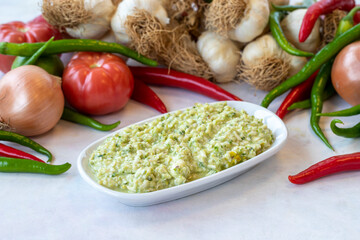 An appetizer prepared with feta cheese and pistachios. Traditional Turkish and Arabic cuisine meze. Snack meal served alongside the main course. Natural vegetarian food. Local name grit ezmesi mezze