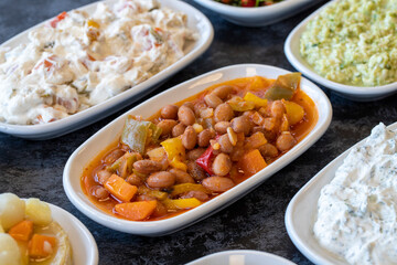 Kidney bean appetizer. Traditional Turkish and Arabic cuisine meze. Snack meal served alongside the main course.Bulk appetizer plates Natural vegetarian food. Barbunya plaki. Chili beans