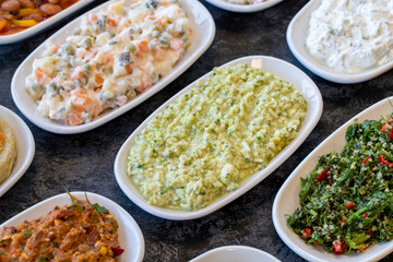 An appetizer prepared with feta cheese and pistachios. Traditional Turkish and Arabic cuisine meze. Natural vegetarian food. Bulk appetizer plates Local name grit ezmesi mezze