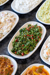 Tabboule appetizer. Traditional Turkish and Arabic cuisine meze. Snack meal served alongside the main course. Natural vegetarian food.  Bulk mezze plates.  Local name taboule mezze.