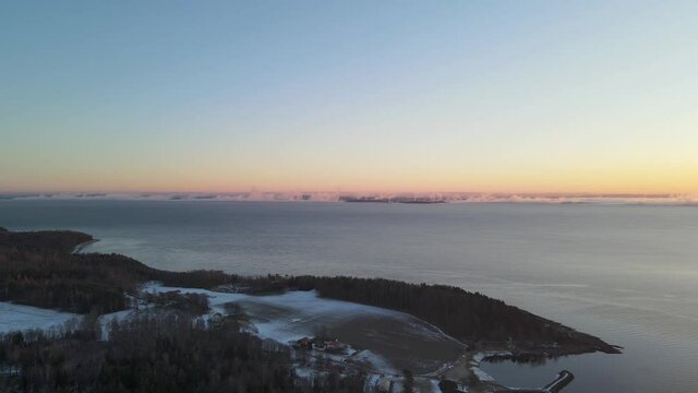 Sunrise time over Oslofjord in Southern Norway. Drone footage
