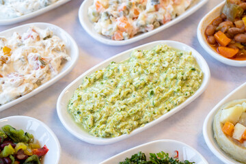 An appetizer prepared with feta cheese and pistachios. Traditional Turkish and Arabic cuisine meze. Natural vegetarian food. Bulk appetizer plates. Local name grit ezmesi mezze