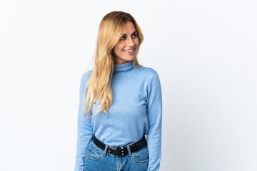 Obraz premium Young blonde Uruguayan woman over isolated background looking side