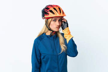 Young blonde Uruguayan cyclist woman isolated on background having doubts
