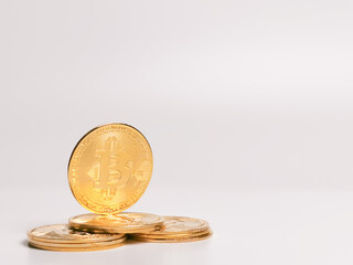 Selective focus bitcoin stacked together isolated on white background.