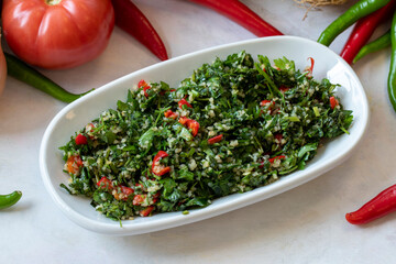 Tabboule appetizer. Traditional Turkish and Arabic cuisine meze. Snack meal served alongside the main course. Natural vegetarian food. Local name taboule mezze.