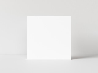 One blank square poster template standing on white table with white background. 3D illustration