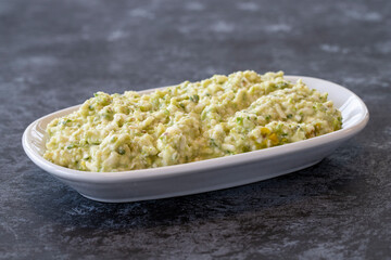 An appetizer prepared with feta cheese and pistachios. Traditional Turkish and Arabic cuisine meze. Snack meal served alongside the main course. Natural vegetarian food. Local name grit ezmesi mezze