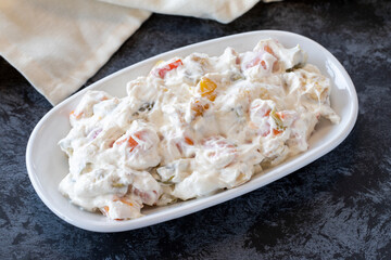 Panco appetizer prepared with potatoes, yogurt and peppers. Traditional Turkish and Arabic cuisine meze. Snack meal served alongside the main course. Natural vegetarian food. Local name Panco mezze