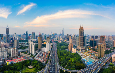 Fototapeta na wymiar Shanghai skyline and buildings with highway at sunset.