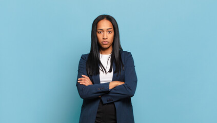 young black woman feeling displeased and disappointed, looking serious, annoyed and angry with...