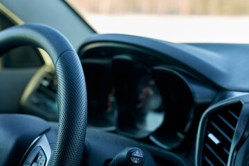 Car. Dashboard and steering wheel close-up. Selective focus