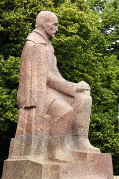 RIGA, LATVIA - JULY 10, 2017: Statue of Rainis (Janis Plieksans), a famous Latvian poet, playwright, translator, and politician in the Riga Esplanade park.