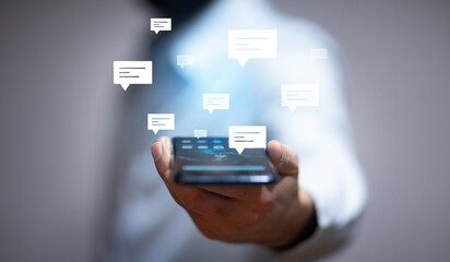 man holding smart phone with letter signs