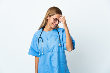 Surgeon doctor woman over isolated white background laughing