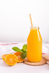 Fresh orange juice in glass  jar with mint, fresh fruits. selective focus.