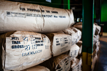 Bags with dried tea leaves in the warehouse of Glenloch Tea factory in Nuwara Eliyah, Hill Country,...