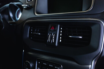 Plakat Ventilation vents with air flow deflectors and car emergency lights button.