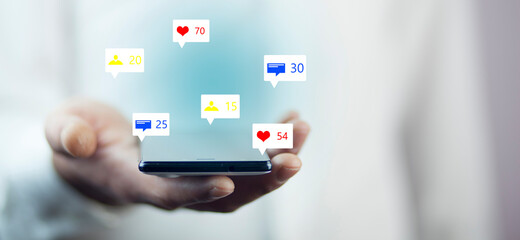 holding social media icons with smart phone