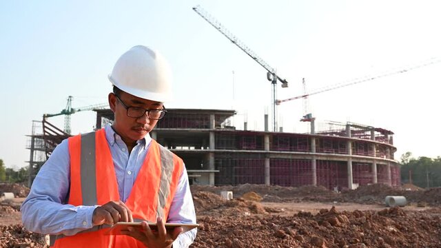 Engineers discuss about work of large building underconstruction