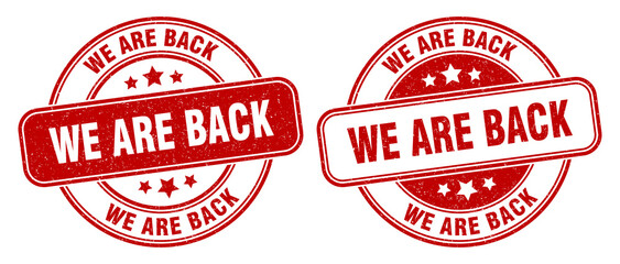 we are back stamp. we are back label. round grunge sign