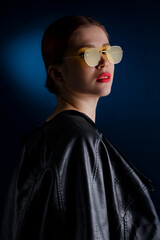 minimal portrait with yellow glasses and red lipstick